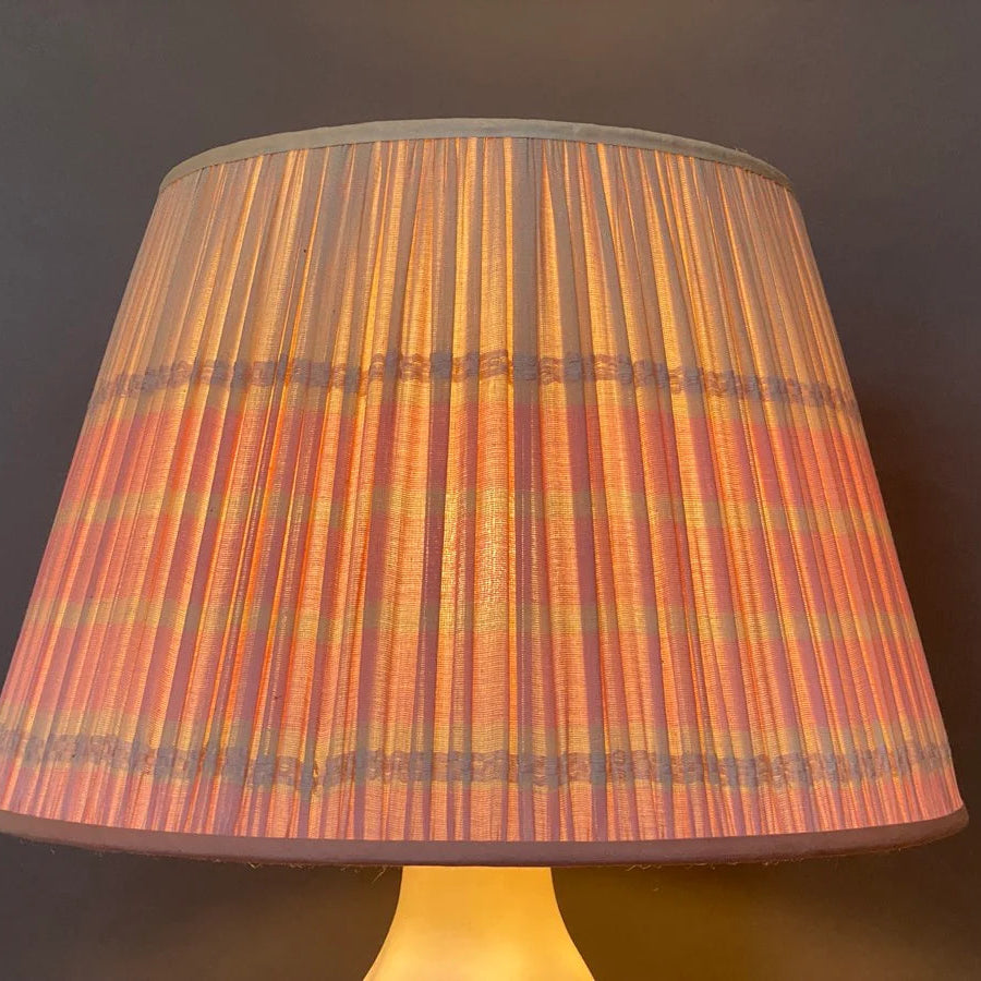 Striped lampshade on a dark background